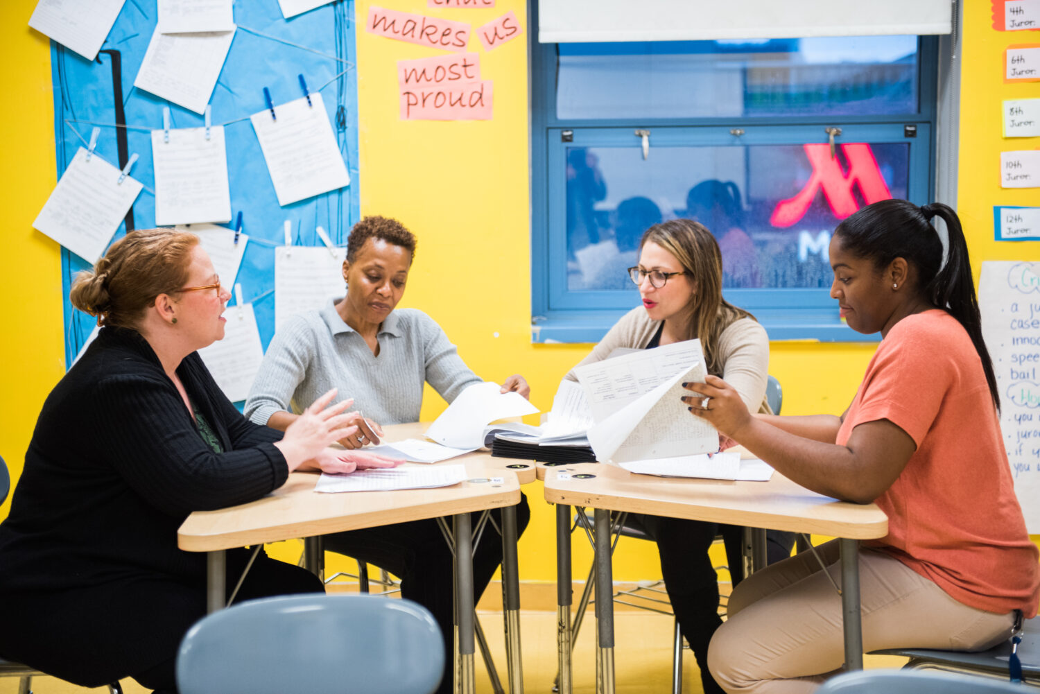 teachers sitting around desks