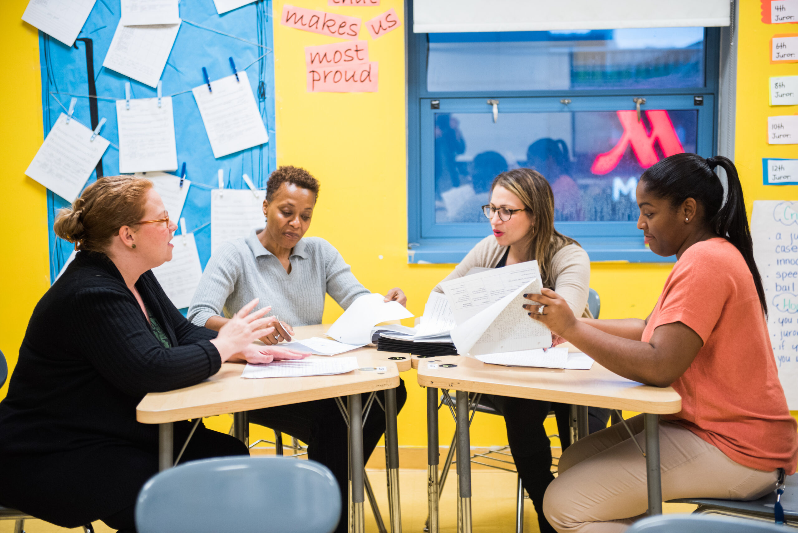 teachers sitting around desks