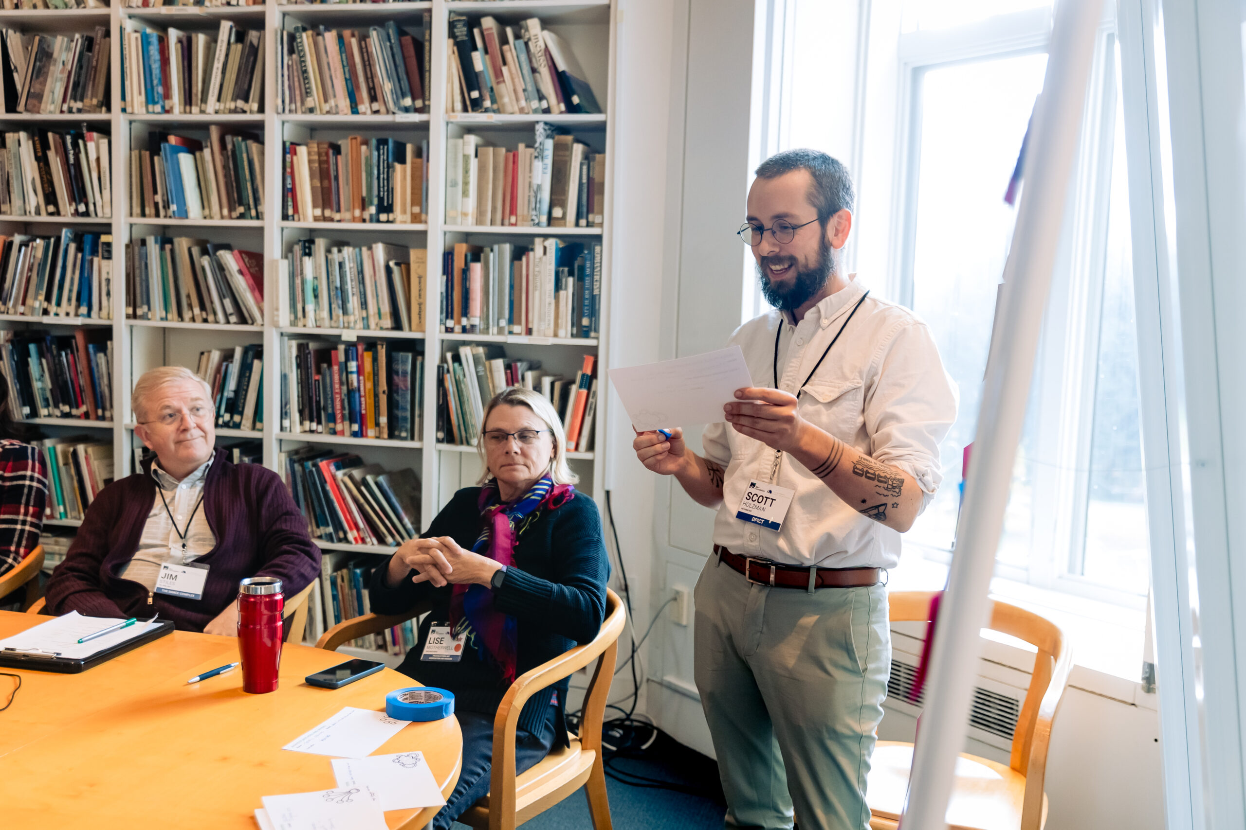 male presenter in library
