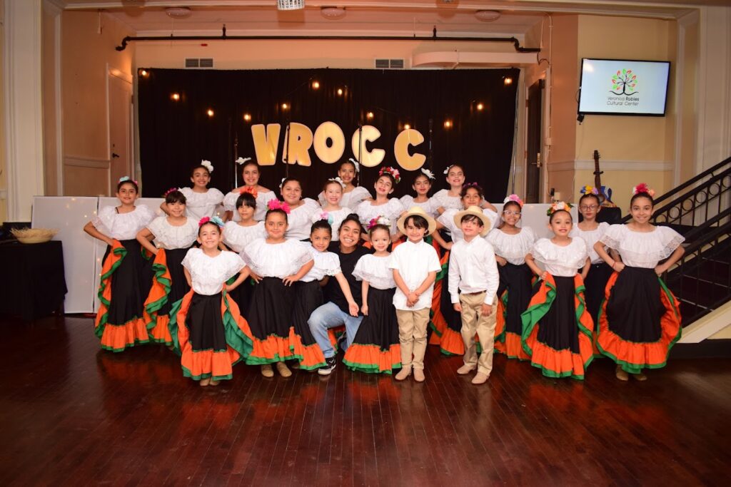 Dancers pose after a show at Vanessa Robles Cultural Center
