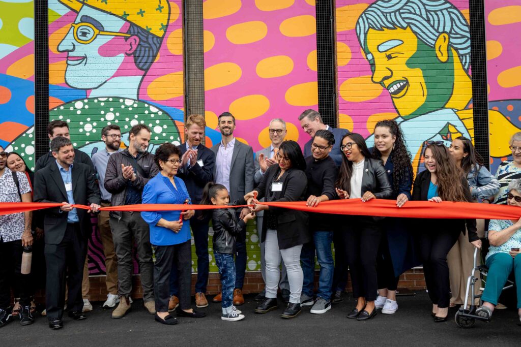 The Neighborhood Developers holds a ribbon cutting for a new space.